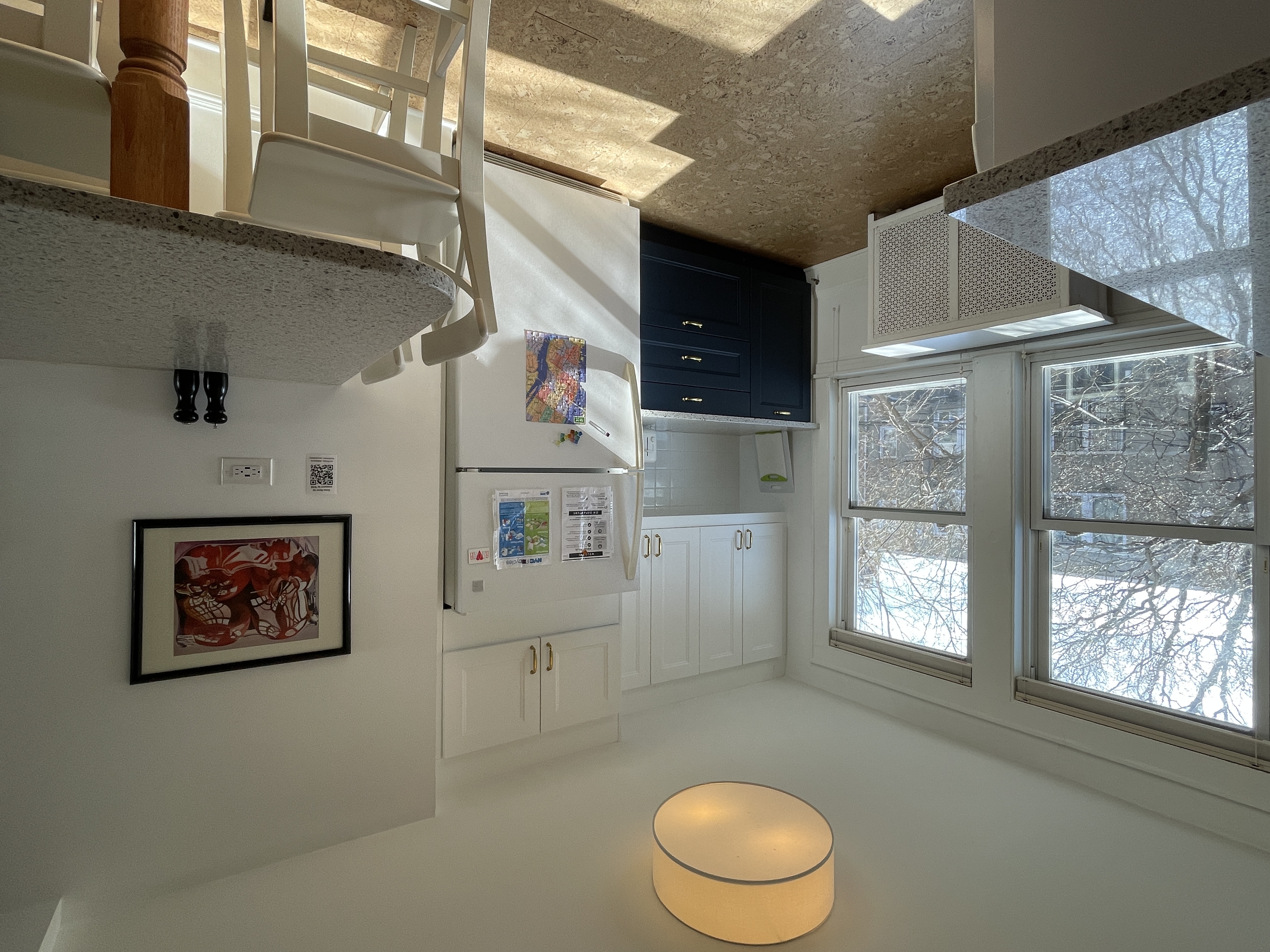 Kitchen with snowy trees visible through the window